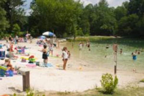 Swimmers at Fuller Lake beach in Pine Grove Furnace State Park.