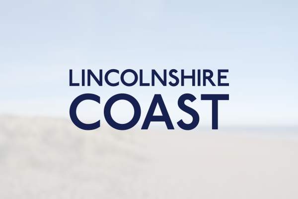The Lincolnshire Coast logo overlayed on a blurred imae of a beach and the sea.