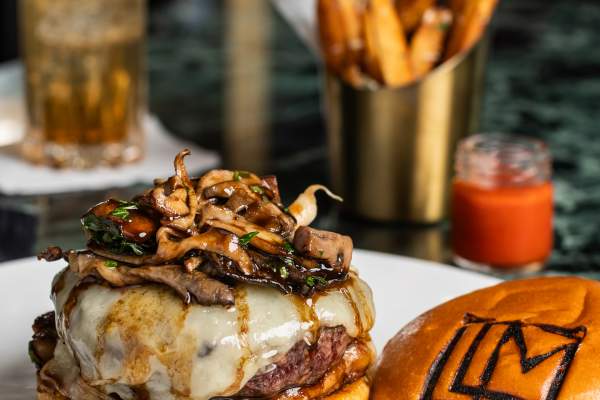 Mason Hills Farm Burger, Seared Foie Gras, Foraged Mushrooms, Caramelized Onions, Gruyere, Bordelaise Sauce, Brioche Bun, Pomme Frites