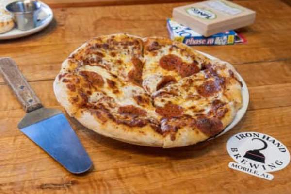 Vegan pizza sliced on a platter