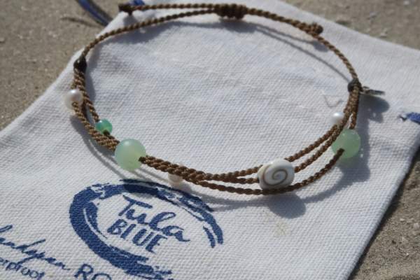 Tula Blue x Port A Riptide Bracelet on a branded pouch at Texas SandFest.