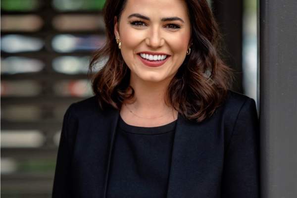 A photo of Brianna Francis wearing a blazer in a professional headshot.