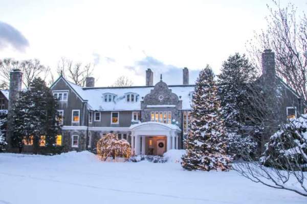 Snow-covered ground at the Blithewold estate during Christmas time