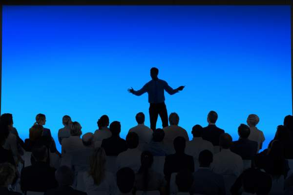 Person speaking to audience