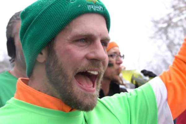 Man Cheering in an Irish beanie