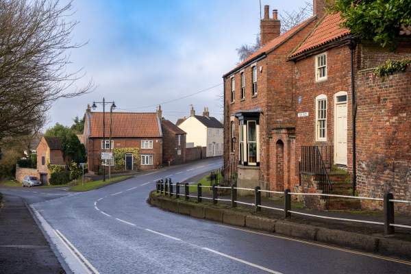 A quiet street in Caistor with houses and road going through the centre