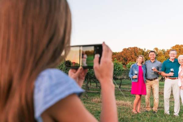 Family poses for photo at winery