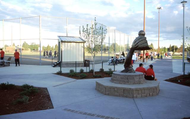 a statue of a glove catching a softball in Brimmer park in cheyenne