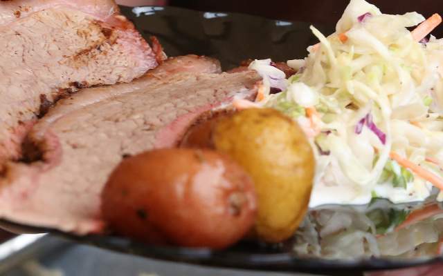 a plate of food with potatos cole slaw and brisket