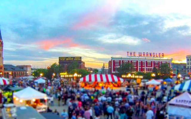 tents set up and people enjoying a concert in the Depot Plaza