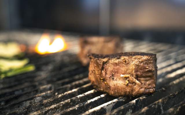 a filet mignon on the grill at the Metropolitan Downtown
