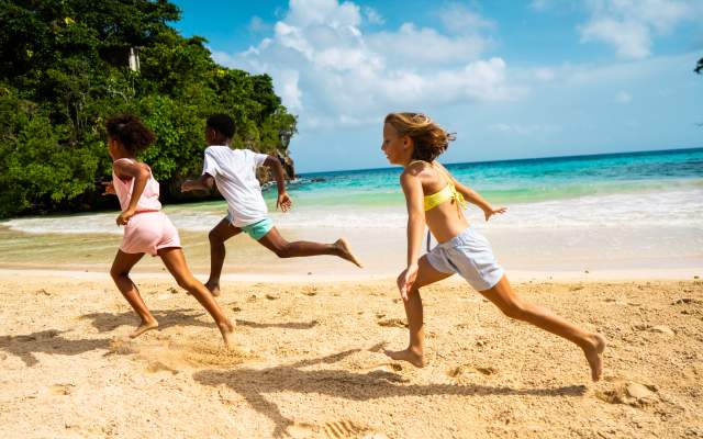 Children running on beach - Frenchman's Cove