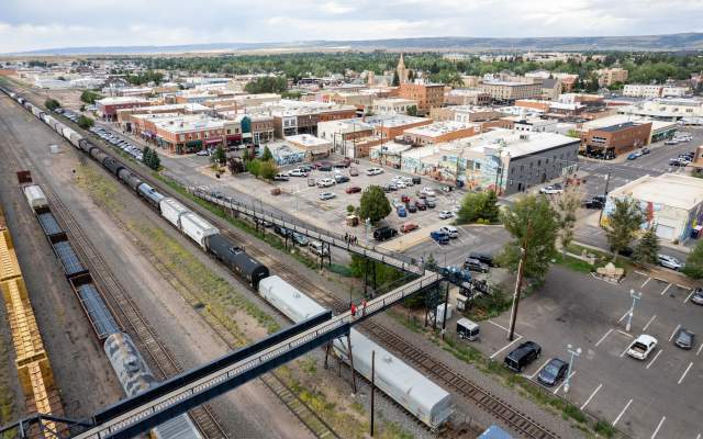 Trains rumble below the Garfield Street Footbridge in Downtown Laramie