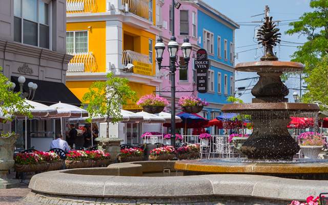 Patio seating surrounds the fountain at DePasquale Square in the Federal Hill neighborhood of Providence