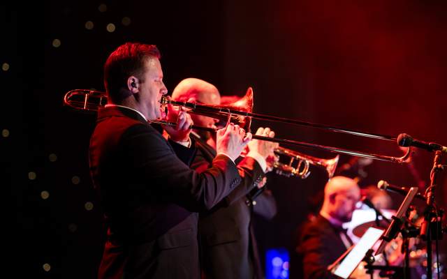 A live band playing brass instruments