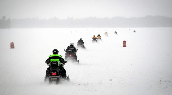 snowmobilers riding