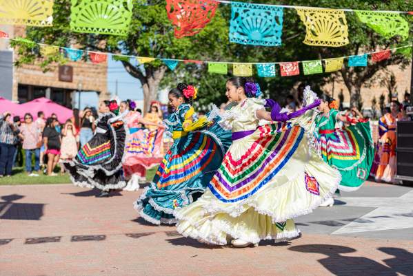 Women dancing in Pat Coursey Park in Jalisco Dresses
