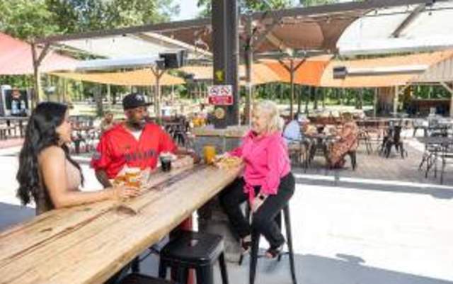 Image of two ladies and a male enjoying beers at Dirtbag Ales Brewery & Taproom
