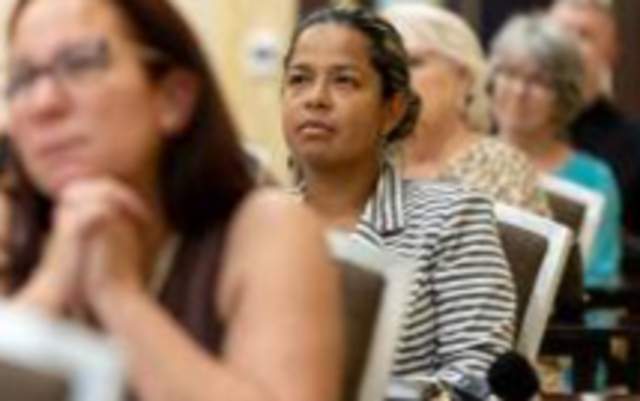 Image of people attending a meeting at the Embassy Suites Fayetteville
