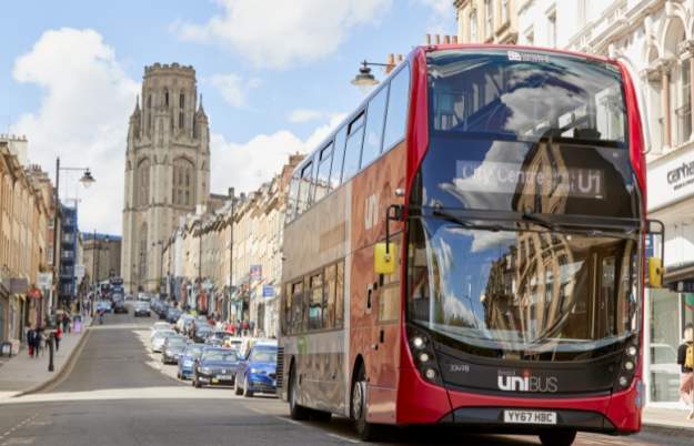A red and black Bristol U1 Unibus driving along Park Street in central Bristol - First Bus
