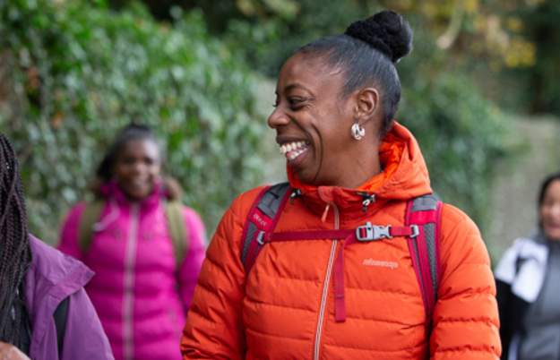 A group of people walking through Eastville Park, Bristol, as part of Bristol Walkfest - credit Alex Rotas Photography