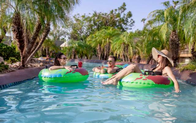 People Enjoying Pool Floaties At Pointe Hilton Squaw Peak Resort In Phoenix, AZ