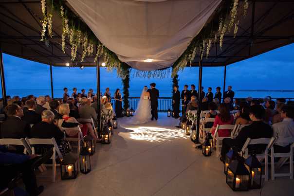 A wedding near the water at Sandestin Golf and Beach Resort includes a view and a fresh breeze.