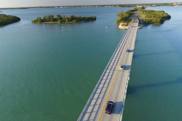 boca grande causeway leading to an island surrounded by blue water