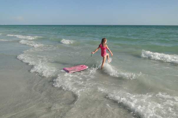 young girl playing in surf, Redington Beach