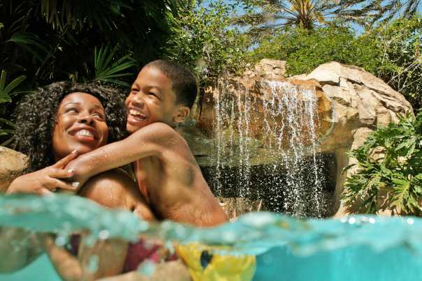 VF_Families2018_Reunion_AA_Lazy%20River%20Mom%20and%20Son%20by%20Waterfall%202.jpg