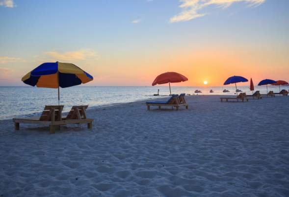 Biloxi Beach Chairs & Umbrellas at sunset