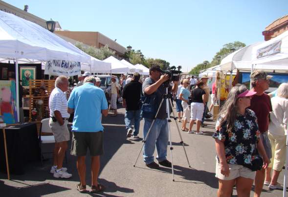 ARTBeat crowd booths TV camera filming