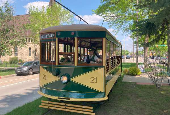 Car 21 going to city park with conductor in driver's seat