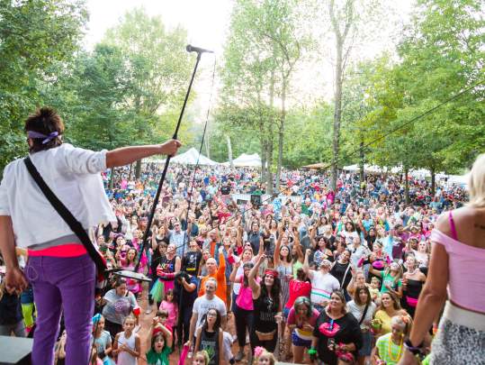 group in forest looking background enjoying live music at Tarara Winery