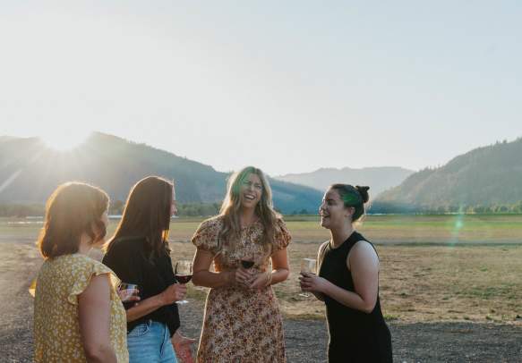 group of women drinking wine
