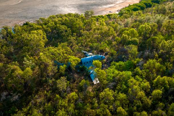 Aerial view of the DC3 WWII wreck on the Kimberley Coast, surrounded by mangroves. Kimberley expedition cruises visit this aircraft wreck on certain itineraries