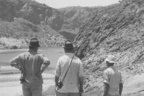 Diversion Dam contractors, Christiani & Nielsen, carrying rifle on a hunting trip near the proposed main Ord River sites early in November 1960-Kununurra Museum