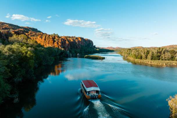 A view of a Triple J Tours boat on tour in the Ord River near Kununurra