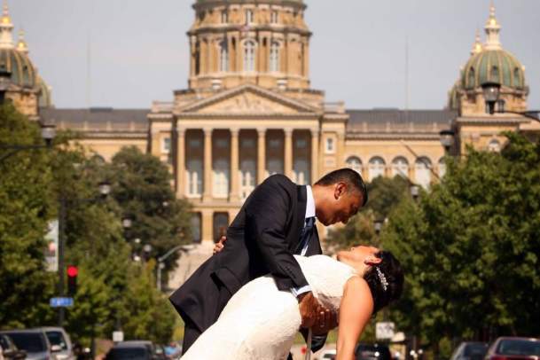 Bride and Groom Posing for Picture in Front of Iowa State Capitol Building