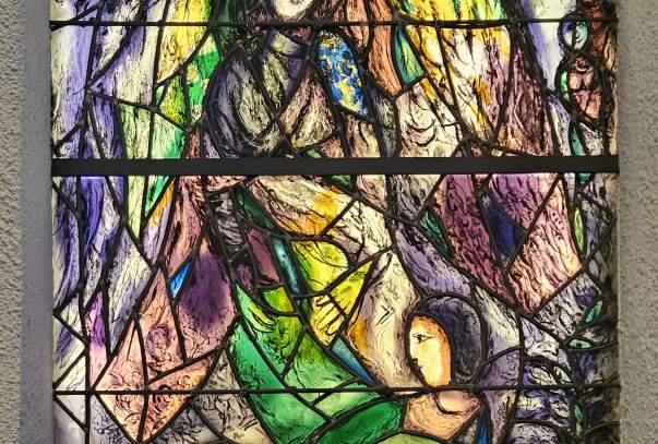 A stained glass window depicting an angel.