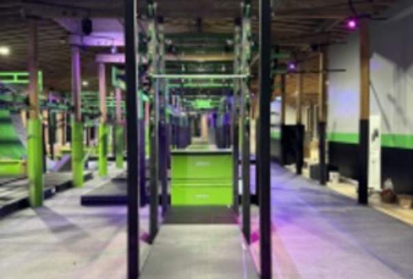 The obstacle course alight in green and purple lighting.