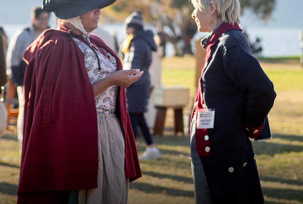 Connie talking face to face with Leslie Bramlet (costumed woman)