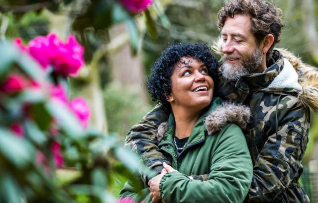 A couple in the grounds of Westonbirt Arboretum near Bristol in spring - credit Johnny Hathaway
