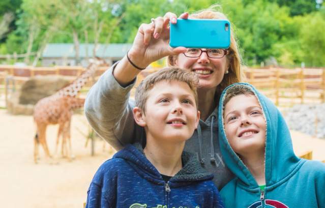 Family with giraffes at Bristol Zoo Project - credit Bristol Zoo Project