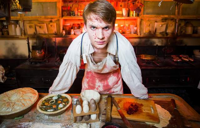 An actor dressed as a butcher covered in fake blood inside Brunel's SS Great Britain, Bristol - credit Adam Gasson