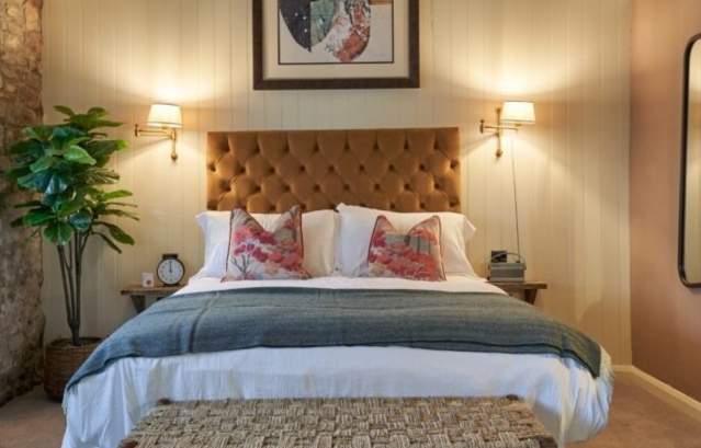 A large bed in a bedroom at The Langford - Credit The Langford
