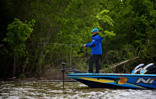 Man Fishing Off of Boat