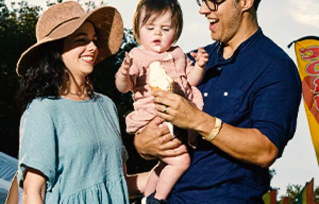 Young family with baby eating ice cream