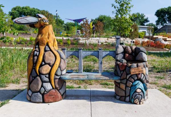 Carved Bench with gnome and dragonfly