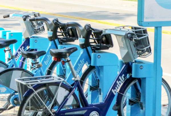 getting here bublr blue bikes lined up in docking station